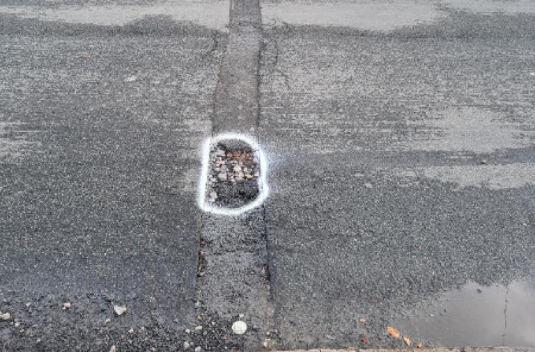 Image example of a road surface trench failure