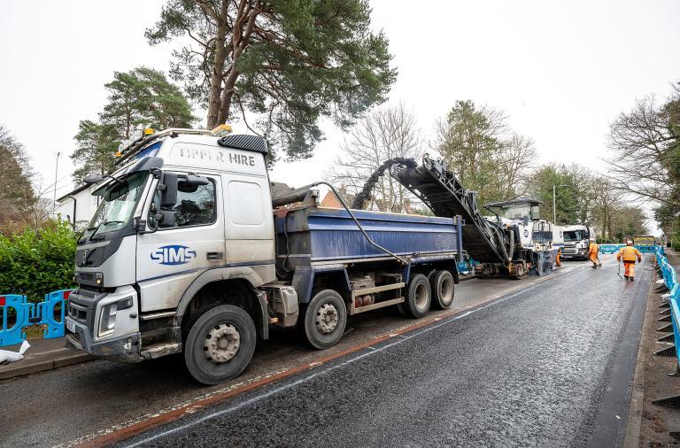 Image of workers completing a new road surface