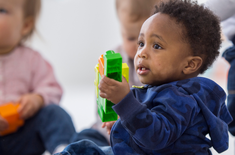 Toddlers playing with blocks