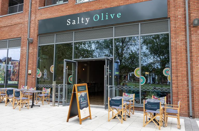 Shop front for Salty Olive in Wokingham with chairs and tables outside