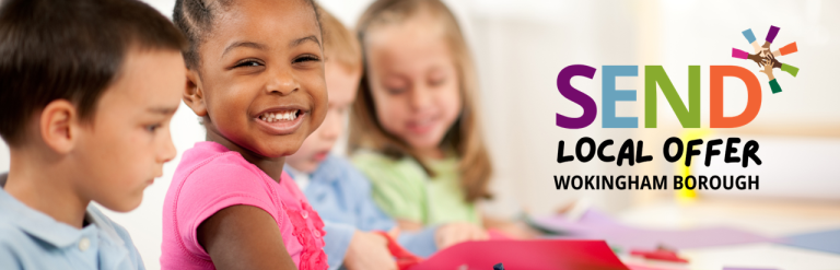 Four children sat a table smiling